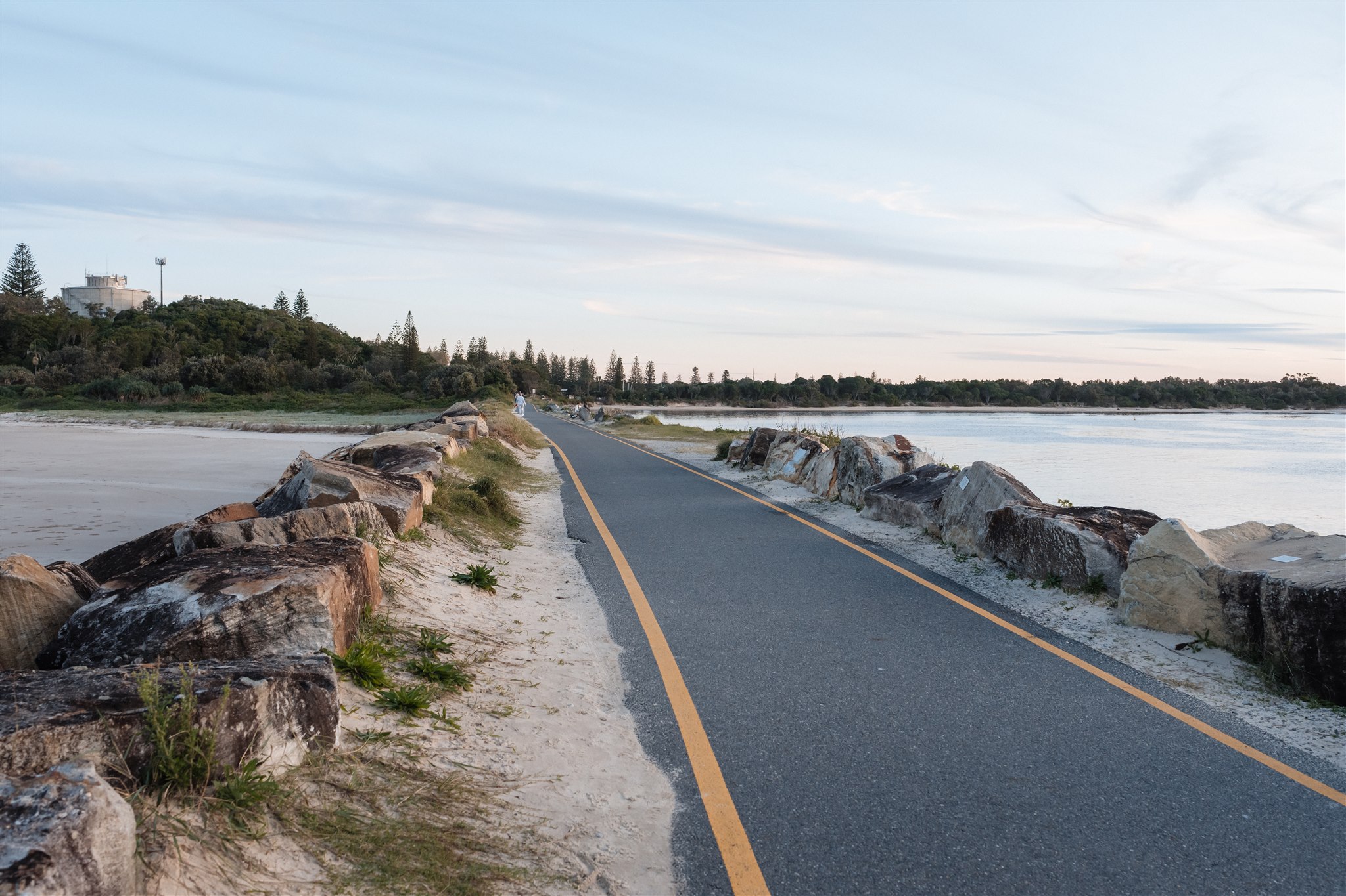 yamba NSW beach, path leading down rock ocean break wall
